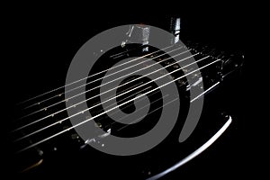 Electric guitar strings in black color.