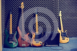 The Electric guitars and bass guitars with amplifiers in the music practice room