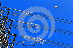 Electric high voltage pillar. Closeup of insulators. Sky background