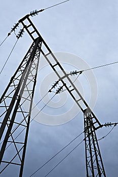 Electric high voltage post with sky background