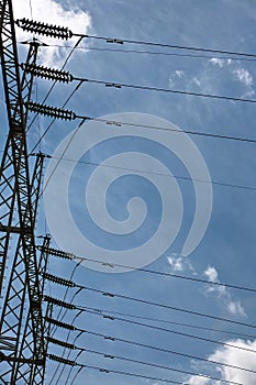 Electric high voltage post with sky background