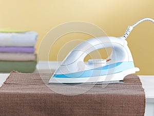 Electric iron isolated in the laundry room