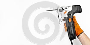 Electric jigsaw. Clamp. Woodworking power tools. Jigsaw in hand. Wooden planks. To the Workshop. On white background. Desktop. Wor