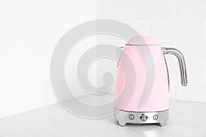 Electric kettle on counter in kitchen. Space for text