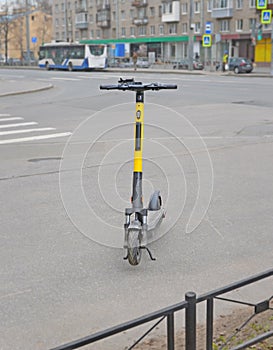 Electric kick scooter on city street