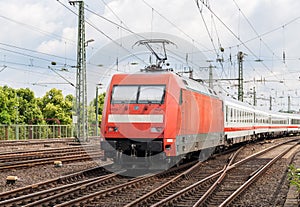 Electric locomotive with passenger train in Cologne