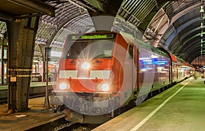 Electric lovomotive with regional express train in Karlsruhe