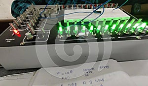 An electronic machine with green and red light