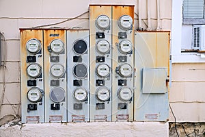 Electric Meters For Apartments are located on the wall outside the building. Close-up