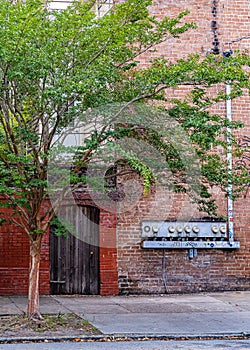 Electric meters and vintage door on beautiful streets and houses in downtown Savannah, Georgia, USA