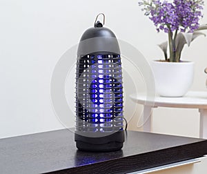 Electric mosquito and insect killer with violet light photo