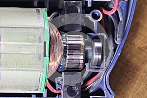 Electric motor with carbon brushes and commutator. photo