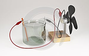 Electric motor running with electrical energy from electrolysis of water. Educational chemistry. 3D Render.