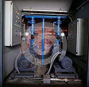 Electric motors driving water pump for building.