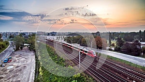 SKM train passing through next to the National Stadium in Warsaw.