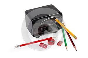 Electric pencil sharpener, manual sharpeners and pencils on white background