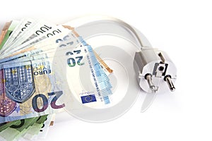 Electric plug with euro money on the white. Energy save concept.