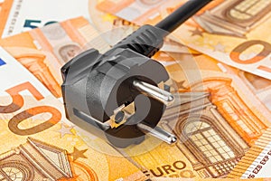 Electric plug on money euro