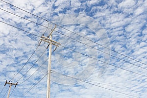 Electric pole on blue sjy day