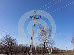 The electric pole and blue sky.