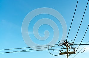 Electric pole and blue sky. Power and energy. Three-phase electric power for transfer power by electrical grids. Global energy