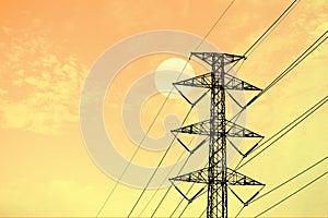 electric pole high voltage transmission tower and lines. Sky sunset background