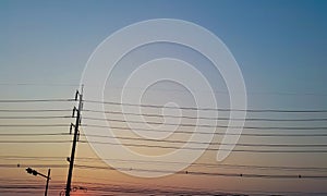 Electric pole in nice sky at dusk.