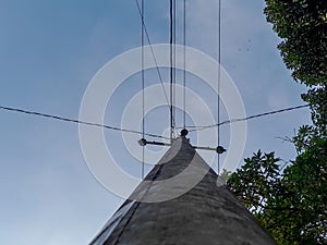 electric pole with a series of cables taken from below