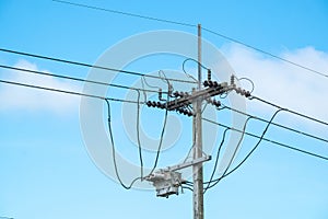 Electric Pole and Electric Transformer on Beautiful Blue Sky Background