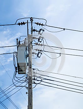 Electric pole and wire in blue sky