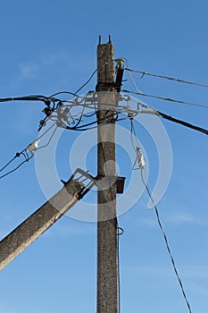 Electric pole with wires and power equipment