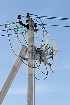 Electric pole with wires and power equipment