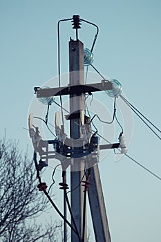 Electric pole with wires and power equipment