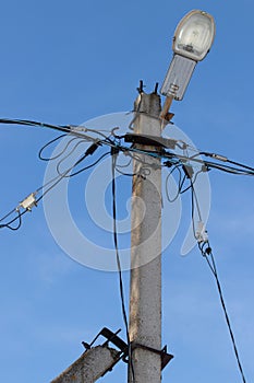 Electric pole with wires and power equipment