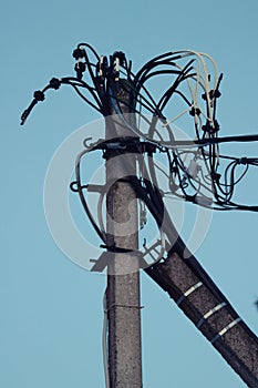 Electric pole with wires and power equipment