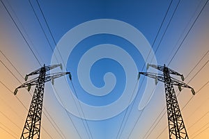 Electric power lines against blue sky