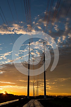 Electric power lines at sunrise. Energy and environment.