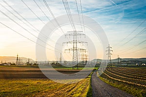 Electric power lines during sunset