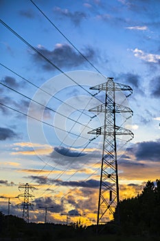 Electric power lines at sunset