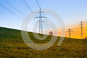 Electric power lines at sunset