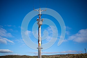 Electric power lines and a wooden pole