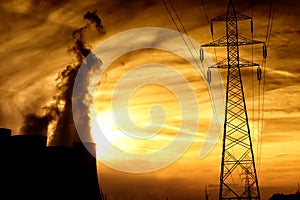 Electric power plant at dusk with orange sky in Kozani Greece