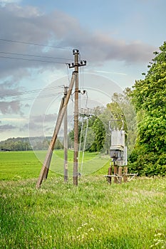 Electric power transformer and poles