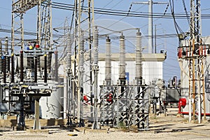 Electric power transmission lines. High voltage switchgear and equipment in front of power plant