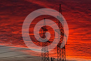 Electric power transmission lines at sunset.