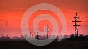 Electric powerline in evening landscape