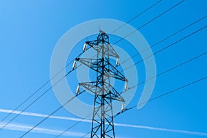 Electric pylon high voltage towers in the blue sky background