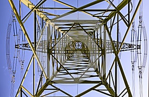 Electric pylon under blue sky