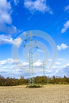 Electric pylon under clear blue sky