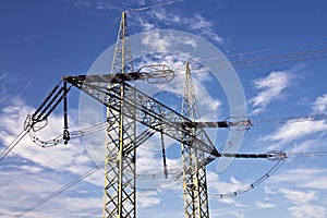 Electric pylons with blue sky